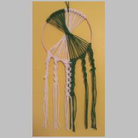 green and white macrame wall hanging